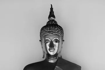 Papier Peint photo Lavable Bouddha Face of buddha statue - light and shadow