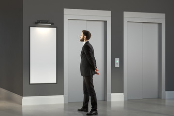 Thinking man in room with lift