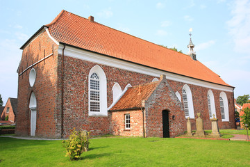 Fototapeta na wymiar The historic church in Greetsiel, Ostfriesland, Lower Saxony, Germany
