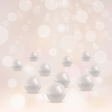 Pearl jewelry beads on blurry bokeh background. 