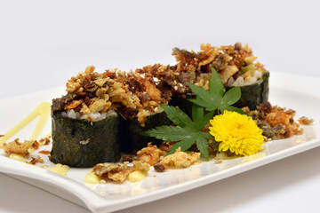 Close-up dry fish roll on white plate and white background