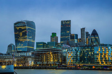 Naklejka premium London, England - Bank, the world famous business district of London with skyscrapers and blue sky at dusk