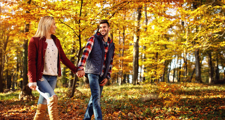 Fototapeta premium smiling couple having fun in park.
