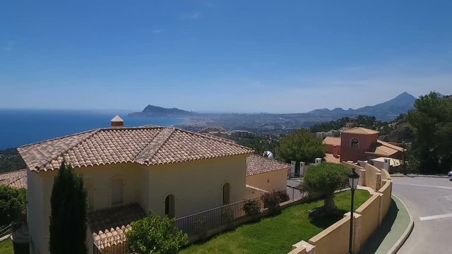AERIAL Altea Hills expensive luxury villas with swimming pools HD AIR Shooting Altea and Benidorm on Mediterranean Costa Blanca Coast, Spain.