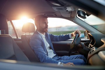 Businessman manager traveling in car.