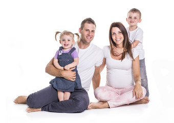 Happy family with two kids on studio white background