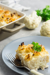 Cheesy cauliflower casserole with ingredients. Selective focus, close up.