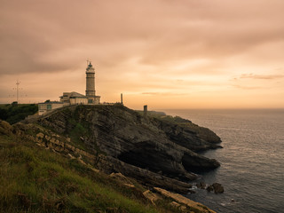 Fototapeta na wymiar Santander, España, Faro de Cabo mayor y acantilado