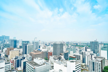 Fototapeta premium Business concept for real estate and corporate construction - panoramic modern city skyline bird eye aerial view under dramatic cloud and morning bright blue sky on Nagoya TV Tower in Nagoya, Japan