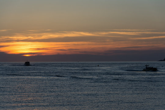 ships at sea during sunset