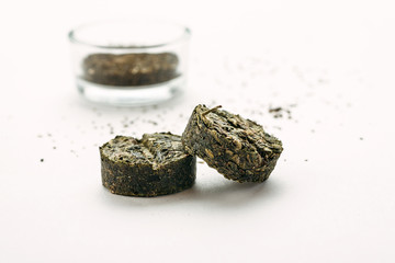 Traditional chinese compressed tea on a white background