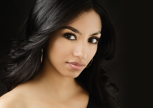 Beautiful face of young woman with dark hair