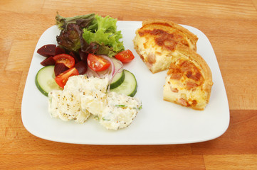 Quiche and salad on a table