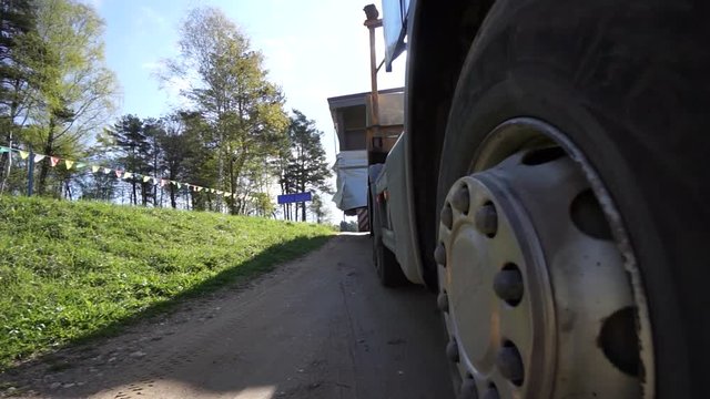 Lorry trucking load wheel close-up, truck transports oversized cargo
