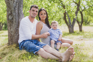 Fototapeta premium Happy Family Having fun with baby playing In The Park.
