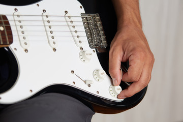 Close up of a lefty electric guitar being played