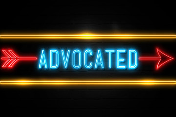 Advocated  - fluorescent Neon Sign on brickwall Front view