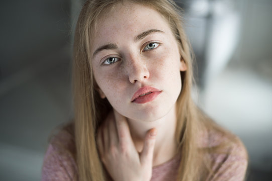 portrait of a beautiful cute girl with freckles