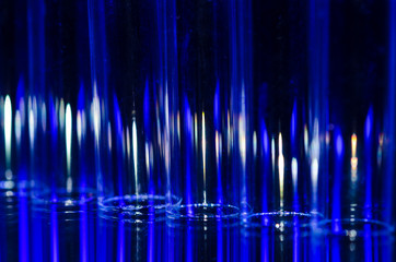 Abstract: Vertical Streaks of Blue and White Light Forming a Fascinating Background