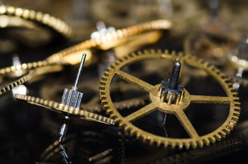 Watch Parts: Collection of Vintage Metallic Watch Gears on a Black Surface