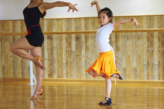 little asian girl learning dance