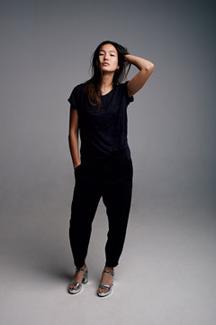 Beautiful young Asian woman in stylish clothes