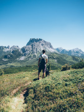 Man looking at mountain peak, Creta di Aip and Zottach Kopf