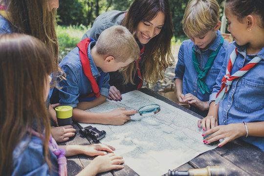Childern Scouts Learning Orinetation Using A Map