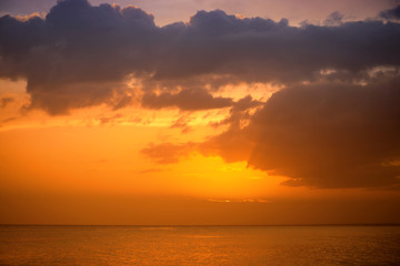 Naklejka na ściany i meble Sunset on the coast of the Caribbean Sea. Dominican sunset.