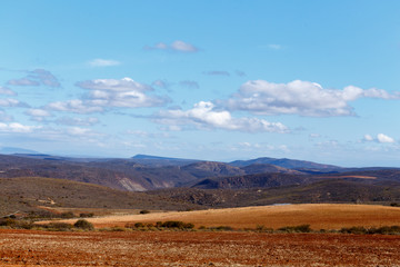 Fototapeta na wymiar Brown landscape with mountains