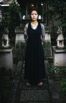 Female Japanese tattoo artist visiting a Shinto Shrine