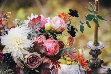Autumn flowers table decor,  floral design on a table for an autoor dinner