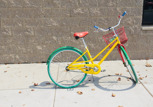 Colorful bicycle parked on the sidewalk