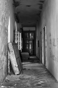 Abandoned Asylum hallway with dirty mattress