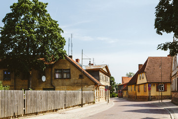 Fototapeta na wymiar Typical houses in latvian city Kuldiga. Street architecture panorama. Kuldiga is a small town in western Latvia