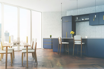 Gray and blue kitchen with a table toned