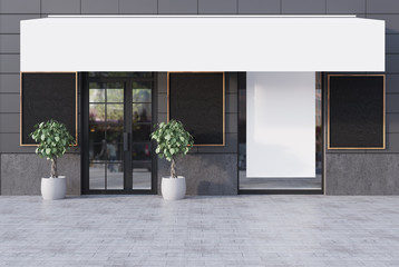 Gray cafe exterior with five posters