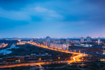 Obraz premium Minsk, Belarus. Aerial Cityscape In Bright Blue Hour Evening And Yellow Illumination Spring Twilight.