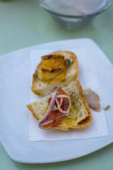 aperitif with appetizers, sandwiches with tomato