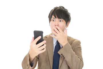 驚いた表情のビジネスマン