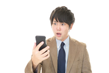 驚いた表情のビジネスマン