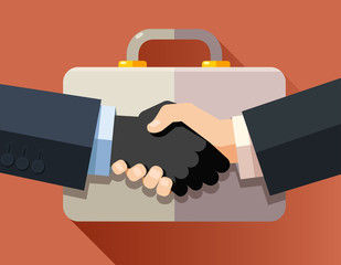 Handshake of corrupt business men on a briefcase background.