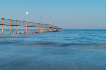 Obraz premium beach and sea at blue hour, summer vacation at the sea