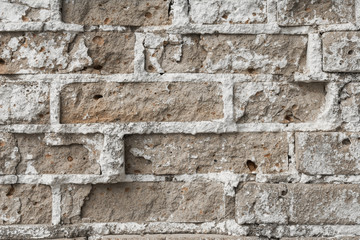 texture of an old ruined brick wall of an ancient building