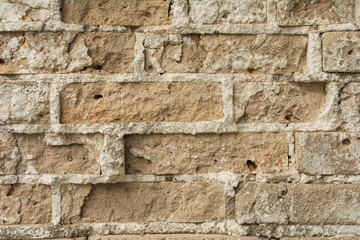 texture of an old ruined brick wall of an ancient building