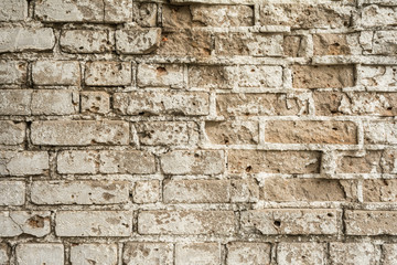 texture of an old ruined brick wall of an ancient building