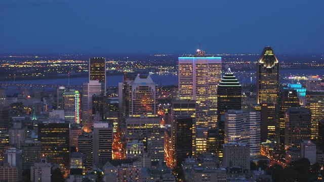 Montreal Quebec Aerial v25 Flying low over downtown at dusk panning with cityscape views