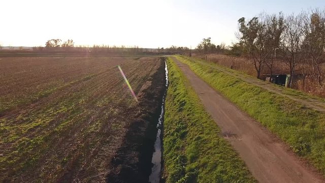 Aerial shot, fall landscape, flying above fields and a huge lake, filmed with drone