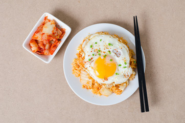 Kimchi fried rice with fried egg on top and kimchi cabbage for eating,Korean food