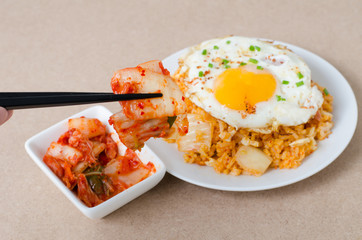 Kimchi fried rice with fried egg on top and kimchi cabbage for eating,Korean food